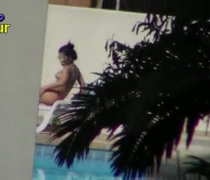 Two cute neighbors tanning at the pool